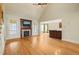 Spacious living area featuring hardwood floors, a fireplace, and seamless flow to the adjacent kitchen at 367 Windham Way, Clayton, NC 27527