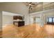 Spacious living room with wood floors, kitchen bar, and staircase overlook at 367 Windham Way, Clayton, NC 27527