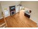 Spacious living room with hardwood floors, fireplace, and abundant natural light from large windows at 367 Windham Way, Clayton, NC 27527