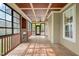 Covered porch with wood flooring, ceiling fans, and screens for a relaxing outdoor space at 367 Windham Way, Clayton, NC 27527