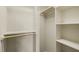A walk-in closet with built-in shelves and wooden rods at 367 Windham Way, Clayton, NC 27527
