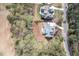 Aerial view of a landscaped property surrounded by lush greenery and mature trees at 370 Chapel Ridge Dr, Pittsboro, NC 27312