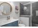 Well-lit bathroom features a glass enclosed shower, modern vanity, and neutral color palette at 370 Chapel Ridge Dr, Pittsboro, NC 27312