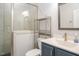 Bathroom featuring shower with glass door, blue vanity, with modern fixtures at 370 Chapel Ridge Dr, Pittsboro, NC 27312