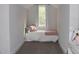 Cozy bedroom with a twin bed, soft linens, natural light, and neutral decor at 370 Chapel Ridge Dr, Pittsboro, NC 27312