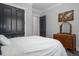 Serene bedroom with a queen bed, dresser, and natural light from the window at 370 Chapel Ridge Dr, Pittsboro, NC 27312