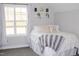 Bright bedroom featuring a large window, white comforter, and decorative wall shelves at 370 Chapel Ridge Dr, Pittsboro, NC 27312