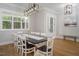 Formal dining room with table, chairs, modern lighting, and hardwood flooring at 370 Chapel Ridge Dr, Pittsboro, NC 27312