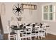 Inviting dining room with set table, decor, chairs, and decorative lighting fixture at 370 Chapel Ridge Dr, Pittsboro, NC 27312