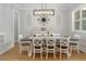 Dining room featuring a large table, stylish chairs, and decorative lighting fixture at 370 Chapel Ridge Dr, Pittsboro, NC 27312