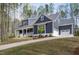 Charming home with a manicured lawn and long driveway at 370 Chapel Ridge Dr, Pittsboro, NC 27312