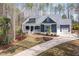 Beautiful home with a manicured lawn and a charming front porch at 370 Chapel Ridge Dr, Pittsboro, NC 27312
