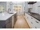 Modern kitchen with a large island and a view to a backyard at 370 Chapel Ridge Dr, Pittsboro, NC 27312