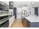 Modern kitchen with stainless steel appliances and a large center island at 370 Chapel Ridge Dr, Pittsboro, NC 27312
