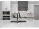 Modern kitchen with white cabinets and stainless steel appliances at 370 Chapel Ridge Dr, Pittsboro, NC 27312