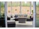 Screened patio with an outdoor lounge area, fire pit, and nature views at 370 Chapel Ridge Dr, Pittsboro, NC 27312