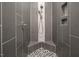 Modern tiled shower featuring a built-in bench and decorative mosaic tile accents at 370 Chapel Ridge Dr, Pittsboro, NC 27312