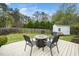 Backyard featuring a wooden deck with fire pit and seating, along with mature trees and a storage shed at 3708 Turnbull Ct, Raleigh, NC 27616