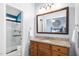 Bathroom showcasing double vanity with granite countertop, wood cabinets, and a mirrored view into the shower at 3708 Turnbull Ct, Raleigh, NC 27616