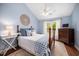 Charming bedroom featuring vaulted ceilings, a ceiling fan, and a cozy, inviting atmosphere at 3708 Turnbull Ct, Raleigh, NC 27616