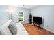 Comfortable bedroom with hardwood floors, ample natural light, and a calming color scheme for a peaceful retreat at 3708 Turnbull Ct, Raleigh, NC 27616