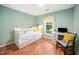 Cozy bedroom with a clean, bright interior design, perfect for relaxation, complemented by a sunny window at 3708 Turnbull Ct, Raleigh, NC 27616