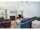 Comfortable living room showcasing a fireplace, ample seating, and natural light, perfect for relaxation and gatherings at 3708 Turnbull Ct, Raleigh, NC 27616