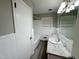 Bright white bathroom with single sink, white cabinets and shower/tub combination at 3711 Halford Dr, Raleigh, NC 27604