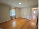 Neutral bedroom featuring hardwood floors, a window, and closet at 3711 Halford Dr, Raleigh, NC 27604