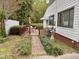 This deck offers outdoor dining near manicured walkway, plus easy access to indoors via convenient awning at 3711 Halford Dr, Raleigh, NC 27604