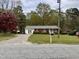 Charming brick ranch home with well-maintained lawn and front porch at 3711 Halford Dr, Raleigh, NC 27604