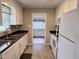 Well-lit kitchen with modern appliances, including microwave, and convenient layout at 3711 Halford Dr, Raleigh, NC 27604