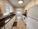 Clean kitchen design with white cabinets, appliances, and granite countertops at 3711 Halford Dr, Raleigh, NC 27604
