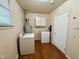 Functional laundry room featuring a washer, dryer, and convenient storage cabinets at 3711 Halford Dr, Raleigh, NC 27604