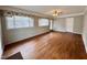 Comfortable living space with ample windows, wood floors, and neutral paint at 3711 Halford Dr, Raleigh, NC 27604