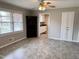 Living room featuring a ceiling fan and an opening to the kitchen at 3711 Halford Dr, Raleigh, NC 27604