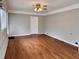 Spacious living room with hardwood flooring, ceiling fan, and natural light at 3711 Halford Dr, Raleigh, NC 27604
