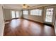 Bright living room showcasing french doors, hardwood flooring, and plenty of light at 3711 Halford Dr, Raleigh, NC 27604