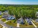 A high angle view of a neighborhood with tree lined streets and well-manicured lawns at 374 Ashley Woods Ct, Clayton, NC 27527