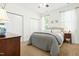 Cozy bedroom with a neutral color scheme, carpeted floors, and ample natural light at 374 Ashley Woods Ct, Clayton, NC 27527