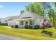 Charming one-story home with covered porch, lush lawn, and easy access to the two-car garage at 374 Ashley Woods Ct, Clayton, NC 27527