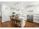 Modern kitchen featuring stainless steel appliances and seating at the kitchen island at 374 Ashley Woods Ct, Clayton, NC 27527