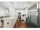 Bright kitchen with stainless steel appliances, white cabinets, and a center island at 374 Ashley Woods Ct, Clayton, NC 27527
