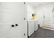 Clean laundry room with modern appliances and ample storage space at 374 Ashley Woods Ct, Clayton, NC 27527