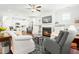 Inviting living room with a cozy fireplace, bright windows, and access to a modern kitchen at 374 Ashley Woods Ct, Clayton, NC 27527