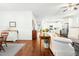 Open floor plan showcasing hardwood floors and seamless transition to the kitchen at 374 Ashley Woods Ct, Clayton, NC 27527