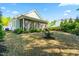 Relaxing screened porch offering a comfortable outdoor living space, with views of the home's neatly landscaped backyard at 374 Ashley Woods Ct, Clayton, NC 27527