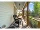 Relaxing screened porch with a rocking chair, offering peaceful outdoor living at 374 Ashley Woods Ct, Clayton, NC 27527