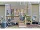 Cozy backyard deck with wooden railing, string lights, and plants, perfect for outdoor relaxation at 4 Scottish Ln, Durham, NC 27707