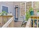 Charming backyard deck featuring outdoor seating, a string of lights, and potted plants for a cozy atmosphere at 4 Scottish Ln, Durham, NC 27707